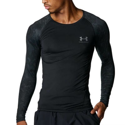 アンダーアーマーUNDERARMOURジムフィットネスヨガウェアインナーシャツアンダーシャツヒートギアコンプレッションカモロングスリーブシャツHGARMOURLSNOVELTY6007728-001メンズ男性25FA秋冬