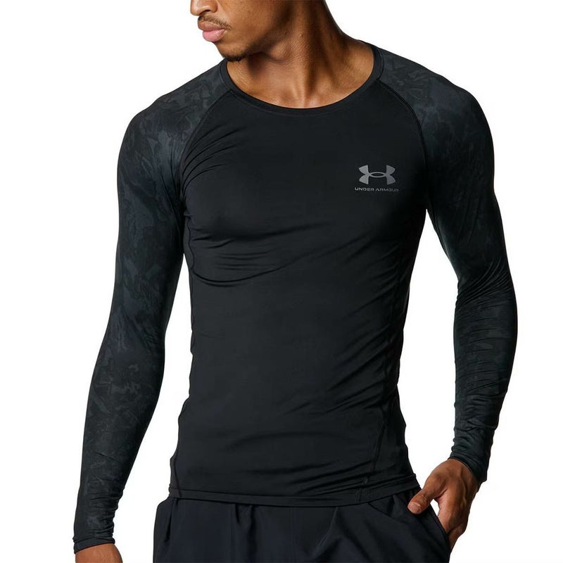 アンダーアーマーUNDERARMOURジムフィットネスヨガウェアインナーシャツアンダーシャツヒートギアコンプレッションカモロングスリーブシャツHGARMOURLSNOVELTY6007728-001メンズ男性25FA秋冬